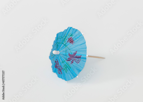 Blue open umbrella pick  isolate on white background.