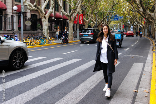 Photography Sweet pretty woman wear dark jacket crossing road in Shanghai