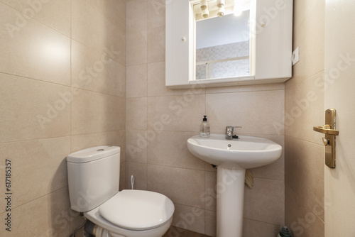 Small bathroom with essential white porcelain toilets