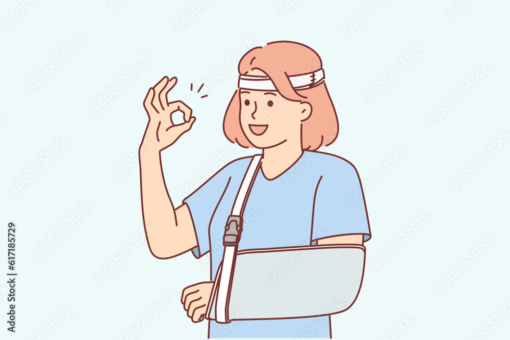 Woman with soft splint on injured arm shows OK gesture rejoices at availability of medical insurance Woman with soft splint on injured arm shows OK gesture rejoices at availability of medical insurance