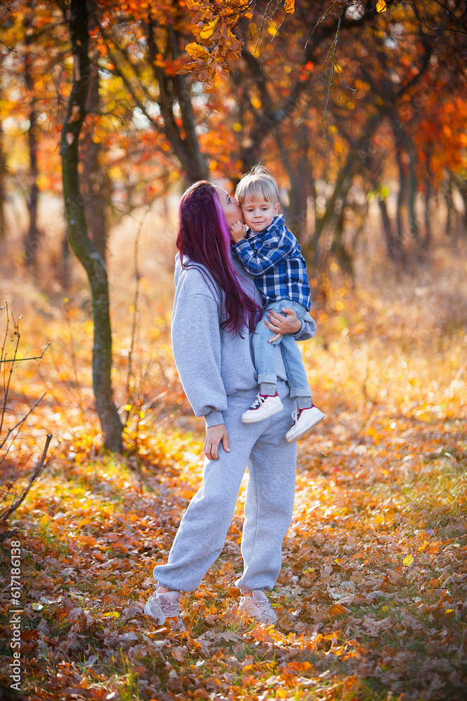 parent and child in autumn forest parent and child in autumn forest
