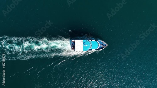 Vacation and leisure. Aerial view on fast boat on blue Mediterranean sea at sunny day. Fast ship on the sea surface. Seascape from the drone. Seascape from air. Seascape with motorboat.