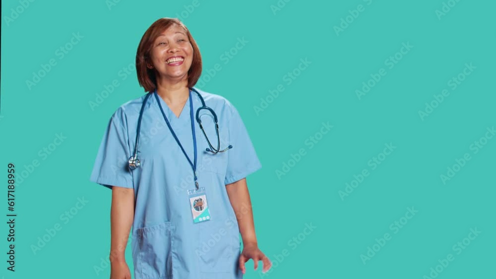 Happy relaxed BIPOC nurse having burst of laughter while at work. Cheerful healthcare specialist enjoying funny chat with clinic coworker during shift break, isolated over studio background Happy relaxed BIPOC nurse having burst of laughter while at work. Cheerful healthcare specialist enjoying funny chat with clinic coworker during shift break, isolated over studio background