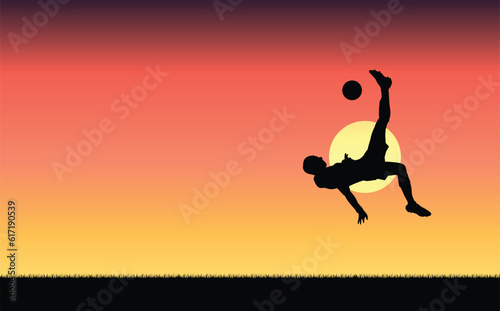 Silhouette illustration of a soccer player doing an overhead kick on a sunset in the background