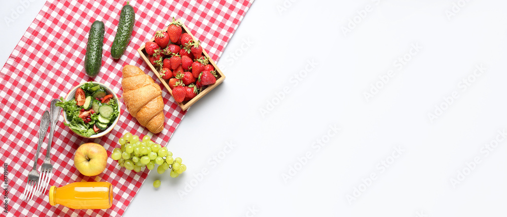 Plaid with tasty food and wine for picnic on white background. Banner for design
