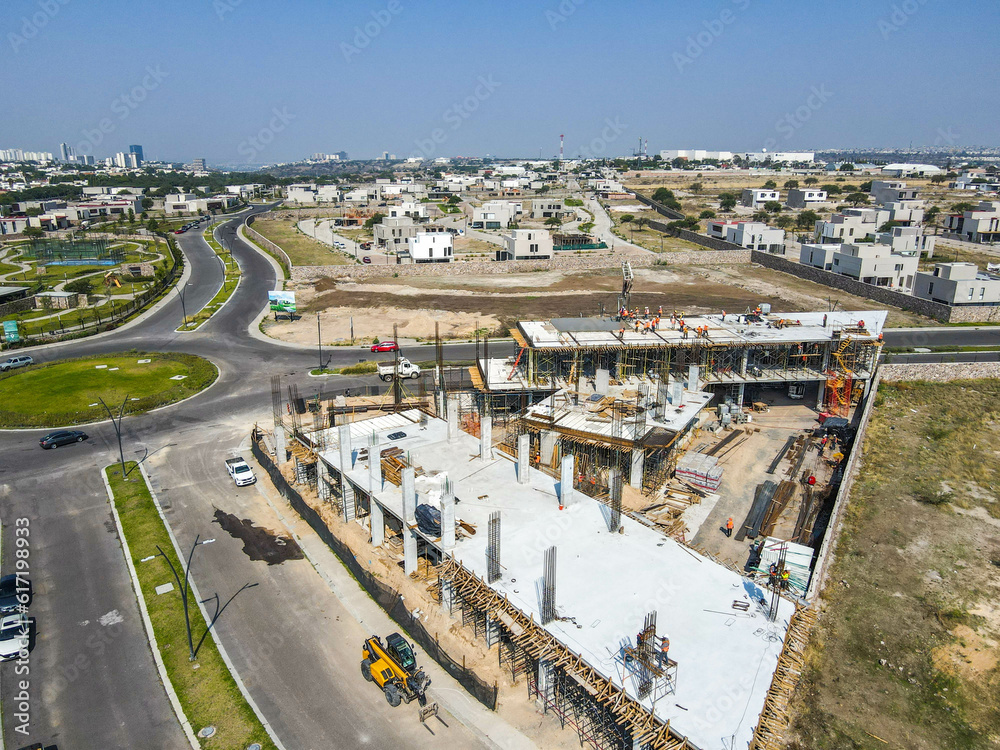 aerial view of construction site. Four construction workers having meeting,stock photo, lake in the street, car ride en la  avenida