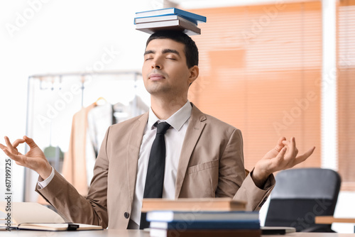 Young businessman with book...