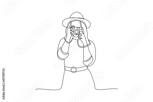 Single one line drawing  Photographer with camera. World photography day concept. Continuous line draw design graphic vector illustration.