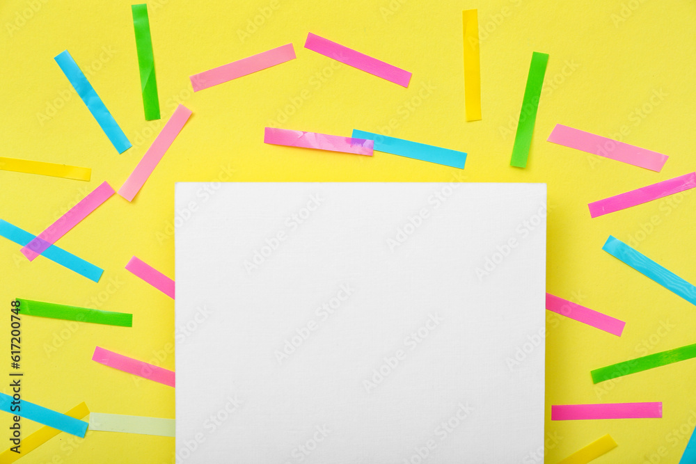 Blank card with confetti on yellow background