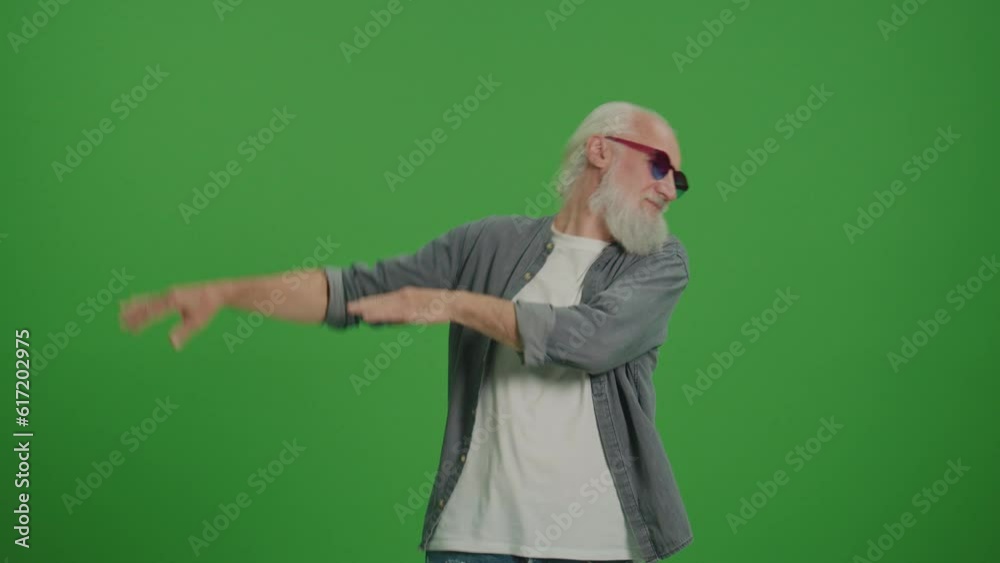 Green Screen. A Happy Old Man Dancing in the Funny Glasses. Smiling Elderly Man Enjoy His Life. Modern Elderly People Concept. Retirement with Pleasure and Without Worries. Green Screen. A Happy Old Man Dancing in the Funny Glasses. Smiling Elderly Man Enjoy His Life. Modern Elderly People Concept. Retirement with Pleasure and Without Worries.