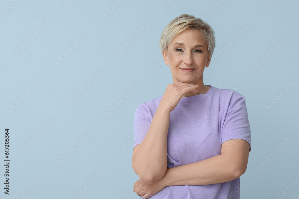 Mature blonde woman on light background Mature blonde woman on light background
