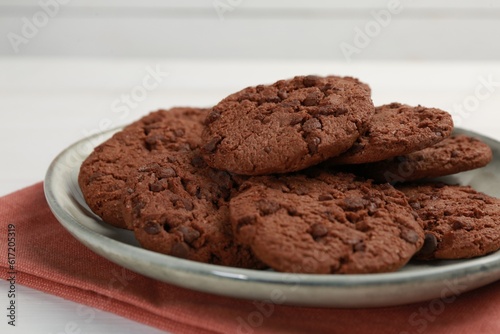 Delicious chocolate chip cookies on white table  closeup