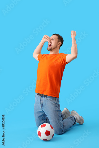 Happy man with soccer ball ...