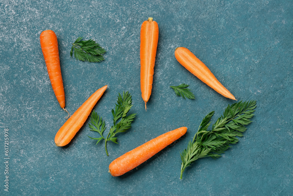 Fresh carrots and slices on green background Fresh carrots and slices on green background