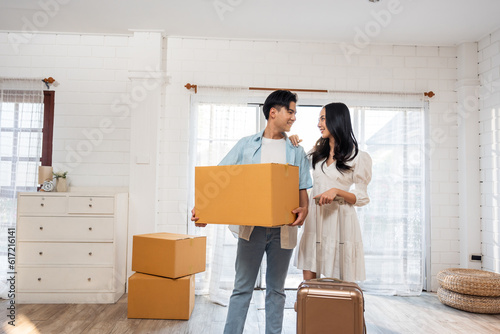 Asian young happy new marriage couple moving to new house together. © Kawee