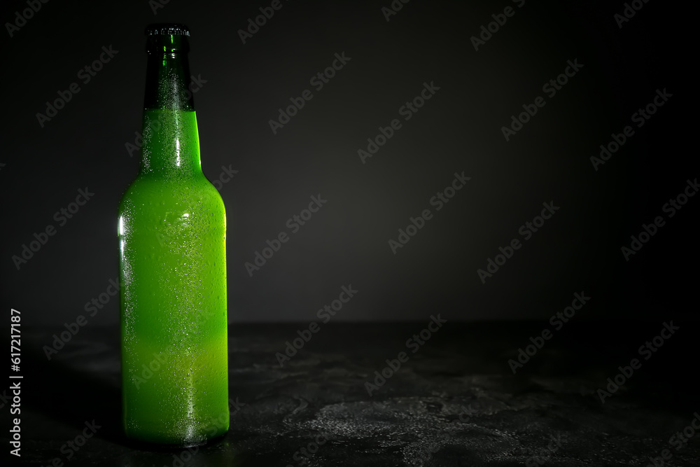 Bottle of cold beer on dark background Bottle of cold beer on dark background