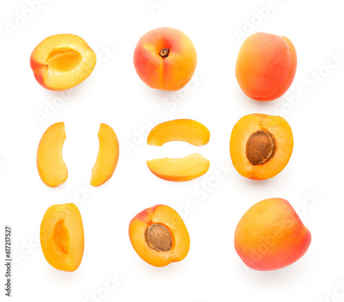 Composition with ripe apricots on white background