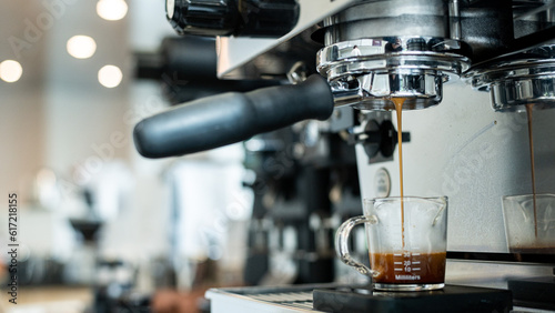 Coffee machine making espresso in cafe, shallow depth of field