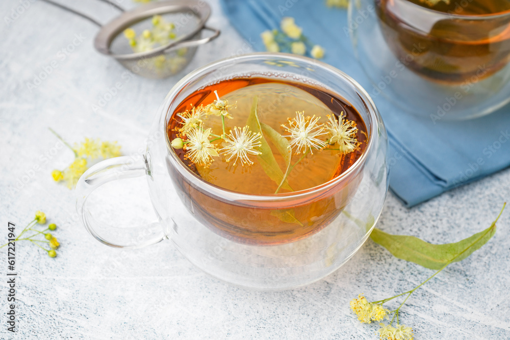 Glass cup of linden tea on white background Glass cup of linden tea on white background