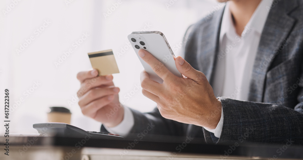 Businesswoman hands holding cradit card and using credit card online shopping. Online shopping concept