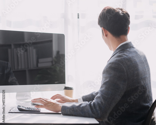 Financial analysts analyze business financial reports on a digital tablet planning investment project during a discussion at a meeting of corporate showing the results of their successful teamwork.