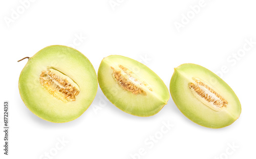 Half of sweet melon with pieces on white background