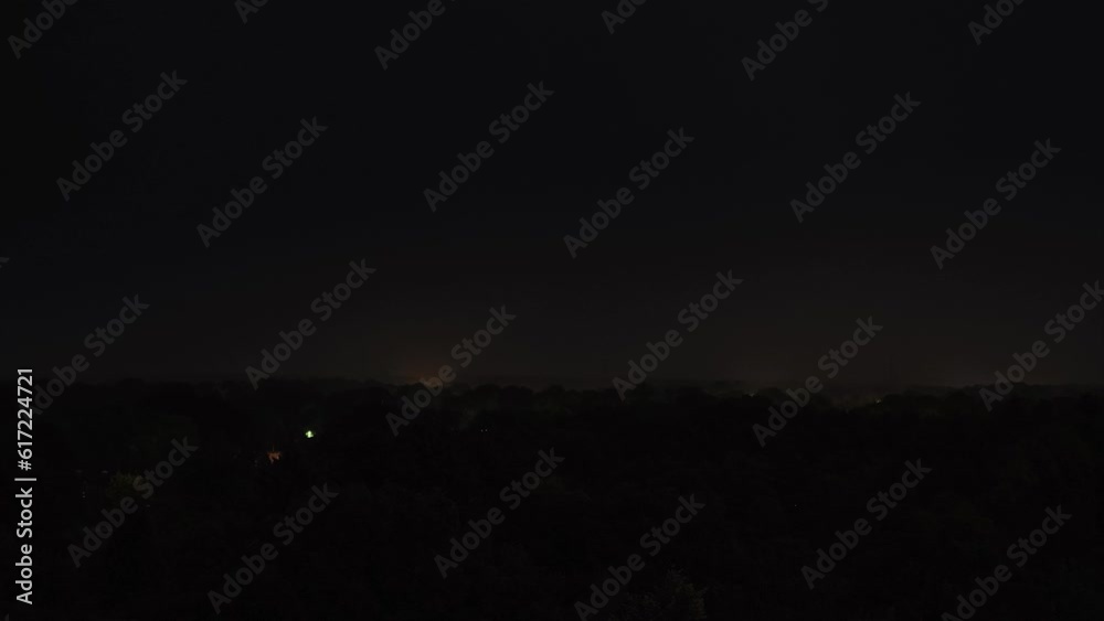 Time lapse sequence of thunderstorm lightning at night over a village Time lapse sequence of thunderstorm lightning at night over a village