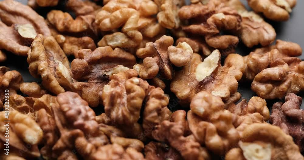 Shelled walnuts close-up on rotating platform Shelled walnuts close-up on rotating platform
