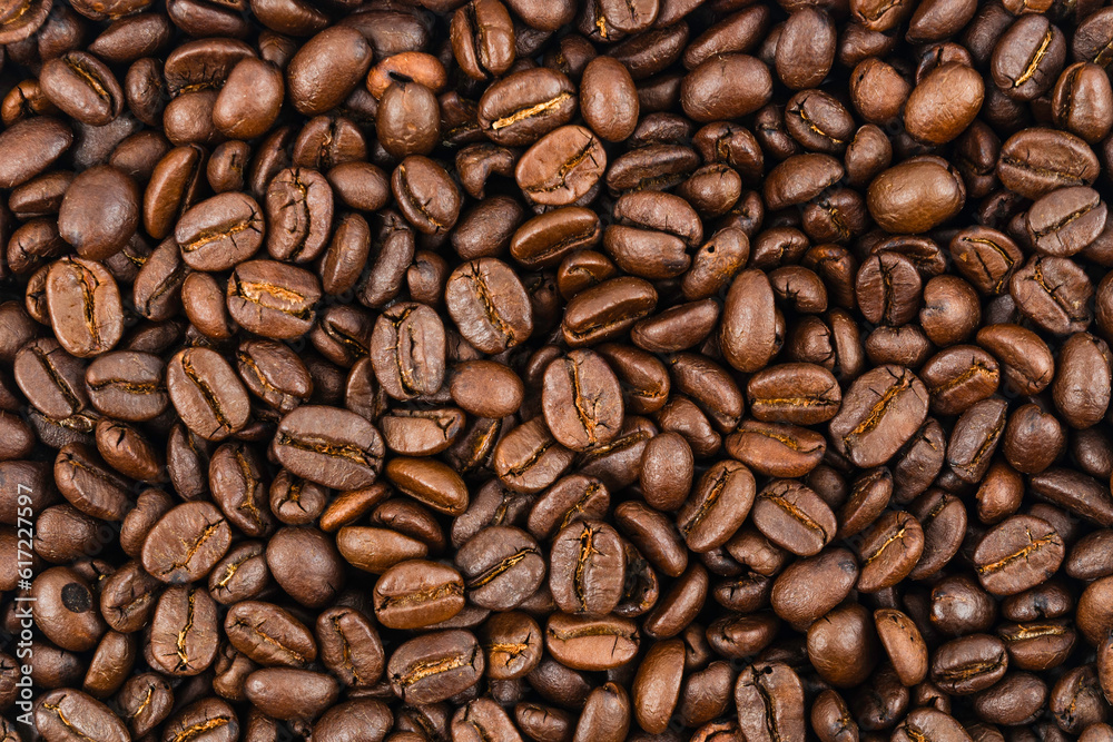Obraz premium Close-up brown coffee beans background.