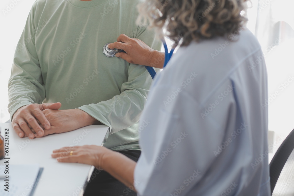 Young doctor visiting elderly woman at home Young doctor visiting elderly woman at home