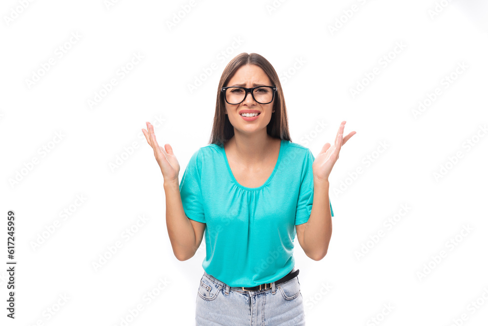 young confused brunette european lady with straight hair dressed in casual clothes wears glasses for vision young confused brunette european lady with straight hair dressed in casual clothes wears glasses for vision
