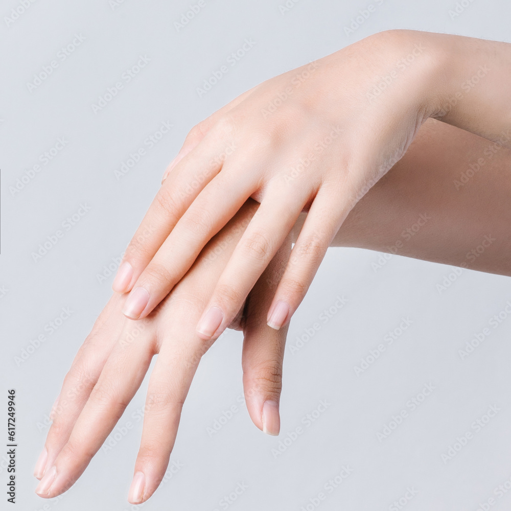 Closeup image of beautiful woman's hands on white background.