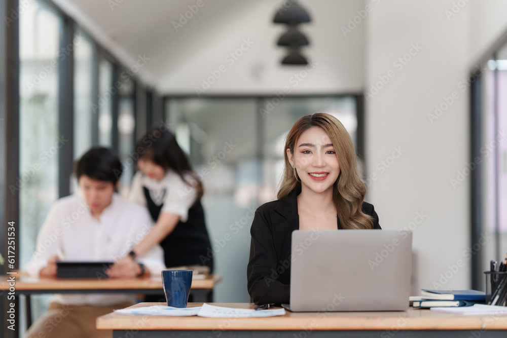 Smiling Asian Accountant person analyze financial report and studies annual figures, analyzes profits Smiling Asian Accountant person analyze financial report and studies annual figures, analyzes profits