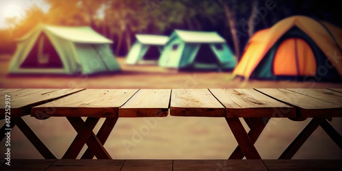 empty wooden table blurred camping tents background