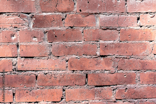texture of an old red brick wall of a buildong