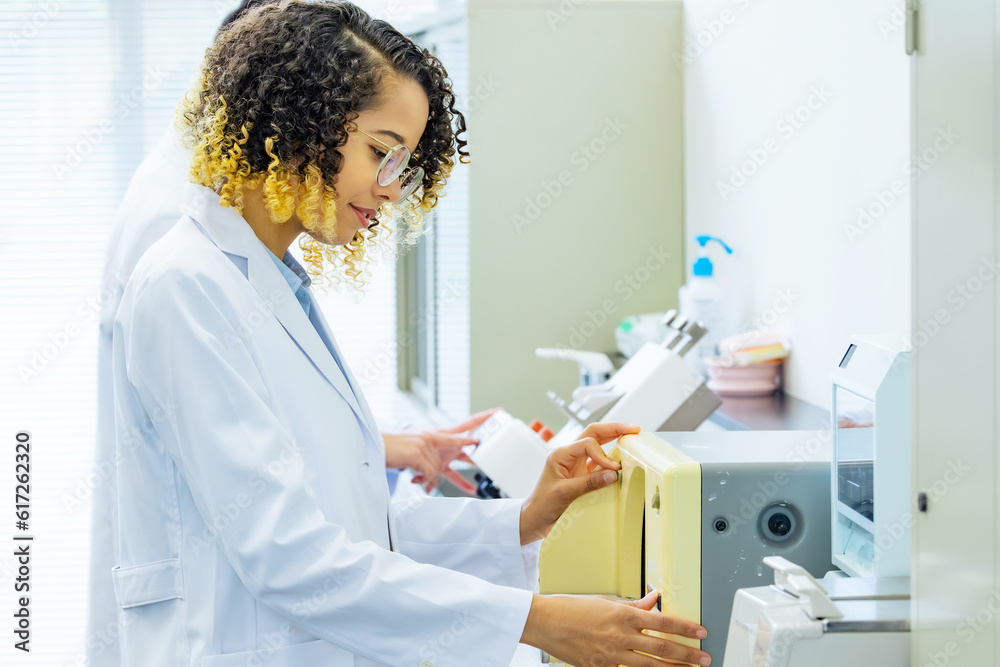 Group of researcher using experimental equipment. Group of researcher using experimental equipment.