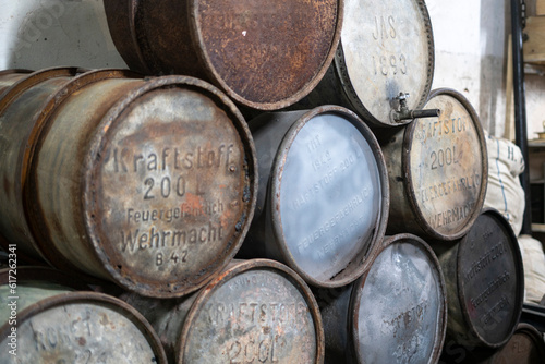 old rusty abandoned alcohol barrels  made in germany © Mihail