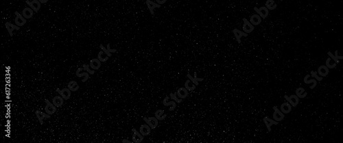 Flying dust particles on a black background  black glitter texture sparkling festive glowing shiny wrapping paper background.
