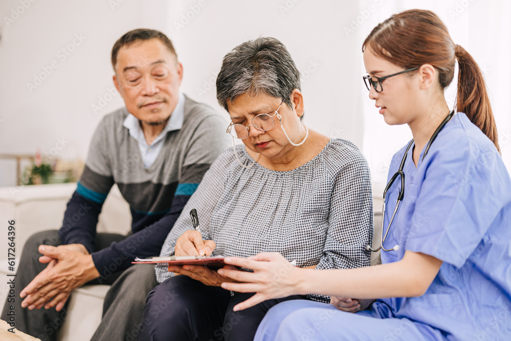 Obraz premium Senior elderly family sign contract medical consent form document with nurse doctor medical staff for financial or donation