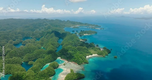 Birds eye view of Bucas Grande Island. White beach near Sohoton Bay. Deep blue sea under clear blue sky. Surigao del Norte. Mindanao, Philippines. photo