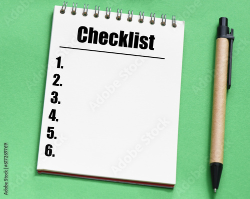 word checklist in office notebook.