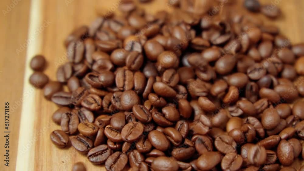 Freshly roasted coffee bean. Masses of falling coffee beans close up. Slow motion Freshly roasted coffee bean. Masses of falling coffee beans close up. Slow motion