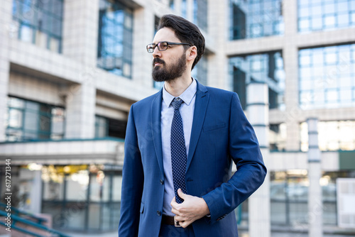 A young perspective businessman in a smart outfit and business outdoor