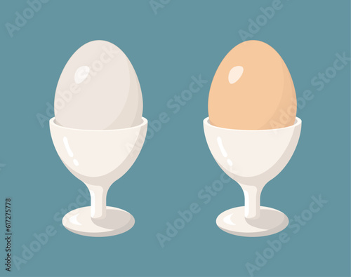 Brown and white boiled eggs in white eggcups. Isolated vector illustration.
 photo