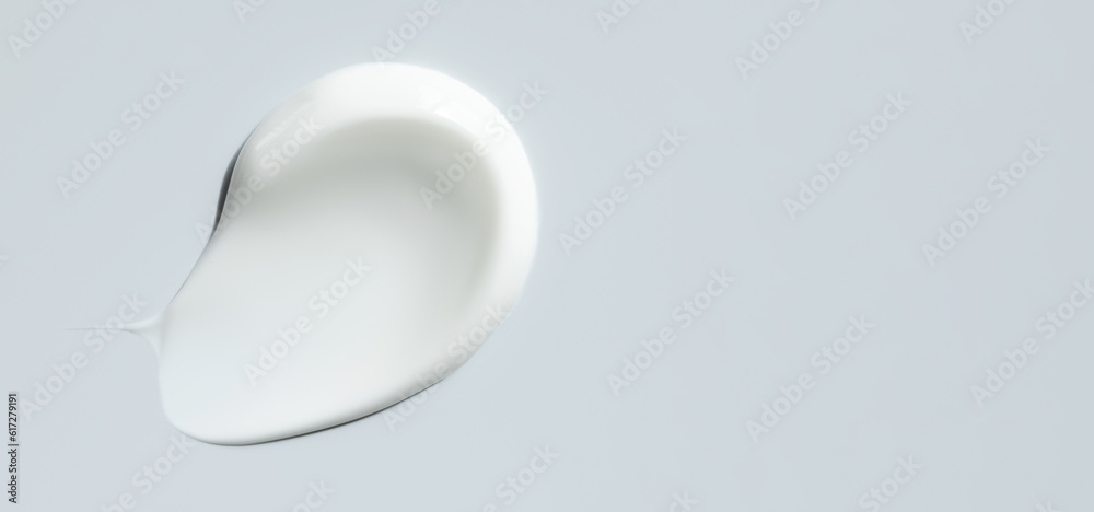 cosmetic smears of creamy texture on gray background cosmetic smears of creamy texture on gray background