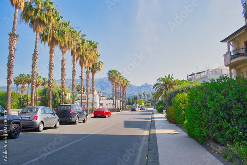 Street in Recanati, a town near Giardini Naxos, with Taormina in the background, Sicily, Italy
