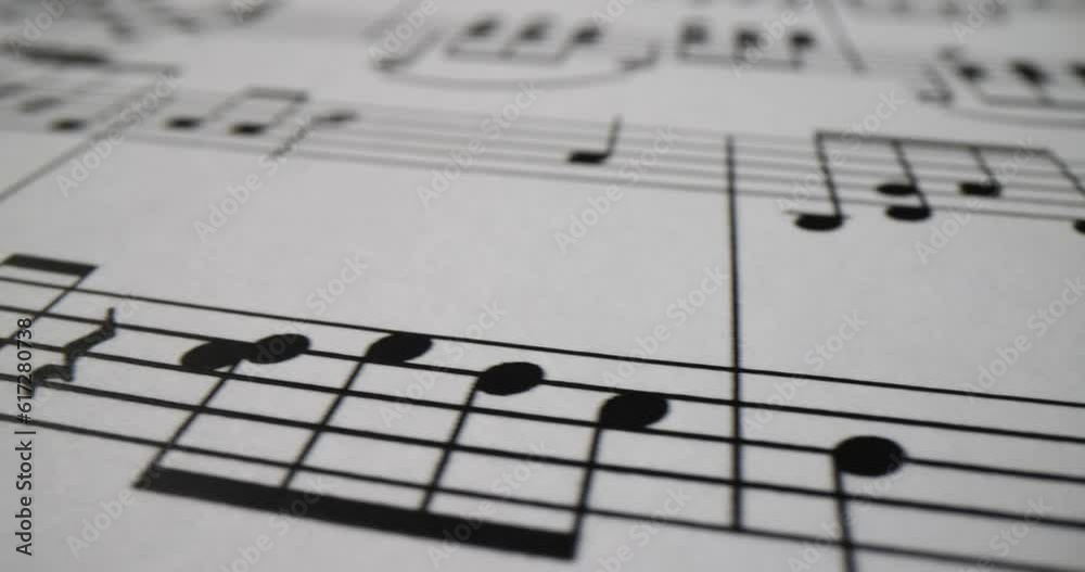 Group musical notes background on paper background closeup 4k movie. Composing melody concept Group musical notes background on paper background closeup 4k movie. Composing melody concept