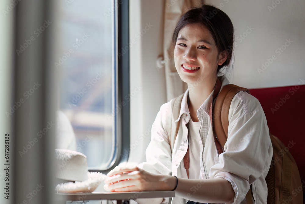 Asian Tourist person backpacker to travel at train station. Tourism and travel in the summer Asian Tourist person backpacker to travel at train station. Tourism and travel in the summer