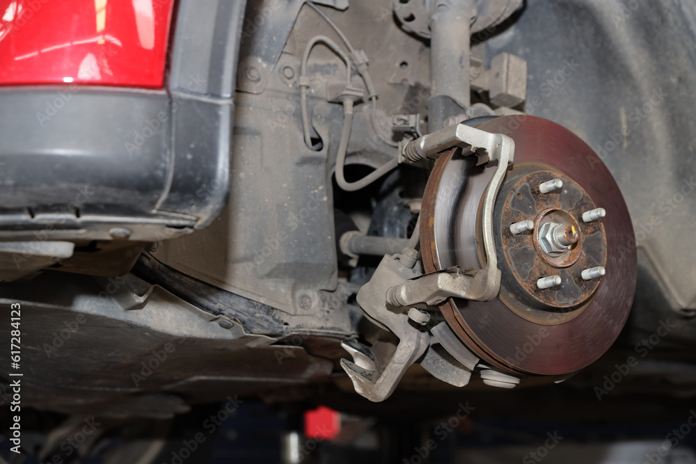 Breakdown vehicle disc break part at repair garage station. Concept of car center repair service. Breakdown vehicle disc break part at repair garage station. Concept of car center repair service.