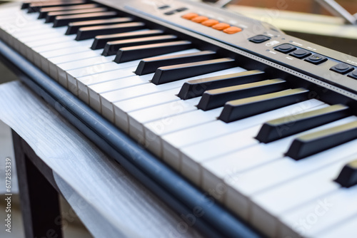 Wallpaper Mural Close-up of piano keys. Piano black and white keys and Piano keyboard musical instrument placed at the home balcony during sunny day. Torontodigital.ca